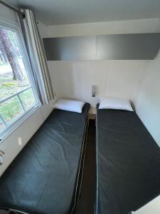 Postel nebo postele na pokoji v ubytování Camping Cobijo