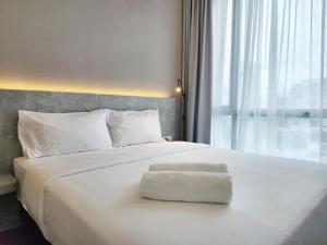 Postel nebo postele na pokoji v ubytování SKS Pavillion Suites