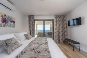 Postel nebo postele na pokoji v ubytování Villa Poseidon