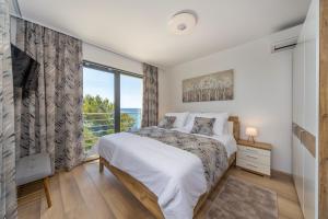Postel nebo postele na pokoji v ubytování Villa Poseidon
