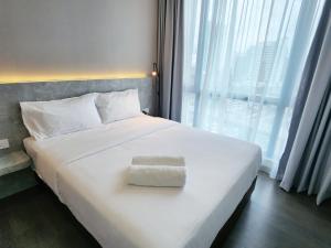 Postel nebo postele na pokoji v ubytování SKS Pavillion Suites