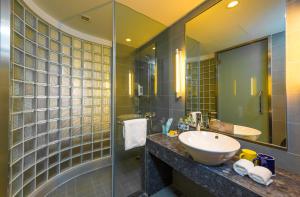 a bathroom with a sink and a shower at Holiday Inn Express Changzhou Lanling, an IHG Hotel in Changzhou