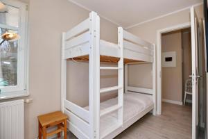 Ένα ή περισσότερα κρεβάτια σε δωμάτιο στο Villa Seepferdchen Wohnung 05