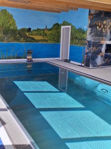 a swimming pool with a view of the water at Idylle in Thale