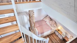 an overhead view of a stair room with a chair at Hohwarthof in Breitnau