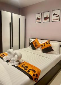 Postel nebo postele na pokoji v ubytování Sampheng Apartment
