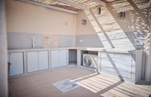 a kitchen with a washing machine in a room at Villa Aqua Blue 1 - Etheras properties in Diakofti +73 photos