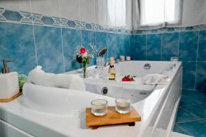 a bathroom with a bath tub with a sink at Il cuore di Lavika in Acireale +53 photos