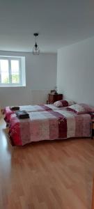 a bedroom with a large bed in a room at Eugénie in Saint-Quentin-de-Chalais +7 photos