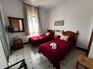 Ένα ή περισσότερα κρεβάτια σε δωμάτιο στο Hotel Entreolivos