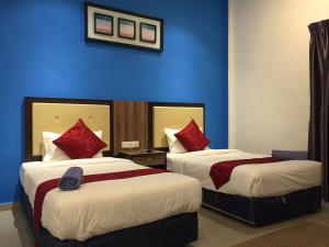 Ein Bett oder Betten in einem Zimmer der Unterkunft Royal Agate Beach Resort