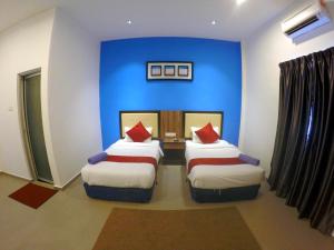 Ein Bett oder Betten in einem Zimmer der Unterkunft Royal Agate Beach Resort