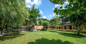 an empty yard in front of a building at Wineport Lodge Agva Riverside Hotel & Winery in Ağva