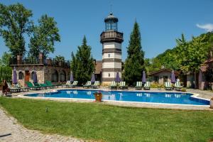 a lighthouse on top of a house with a pool at Wineport Lodge Agva Riverside Hotel & Winery in Ağva