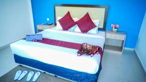 Ein Bett oder Betten in einem Zimmer der Unterkunft Royal Agate Beach Resort