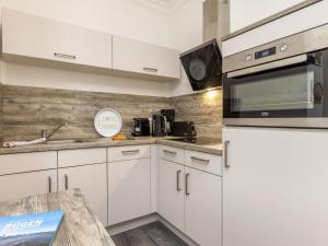 Η κουζίνα ή μικρή κουζίνα στο Ferienwohnung Strandmuschel in der Residenz Clara Sophia