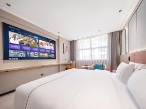 Vuode tai vuoteita majoituspaikassa Yiwu Yunjing Hotel