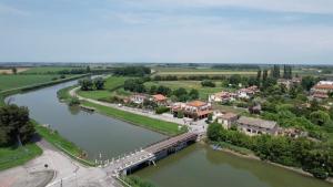 an aerial view of a town next to a river at Le Camere sul Fiume in Boccatossa
