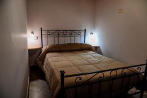 Posteľ alebo postele v izbe v ubytovaní Etna Dimora dei Saponari