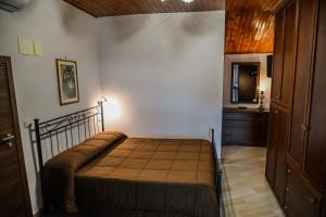 Posteľ alebo postele v izbe v ubytovaní Etna Dimora dei Saponari