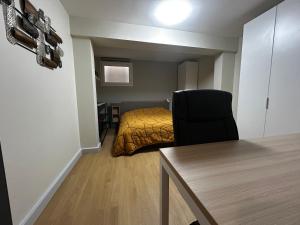 a room with a bed and a table and a chair at Charmante maison à Évian avec terrasse et parking - FR-1-498-113 in Évian-les-Bains