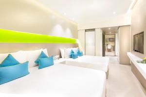 Postel nebo postele na pokoji v ubytování ZIBE Coimbatore by GRT Hotels