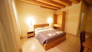 Letto o letti in una camera di Destiny Home & rooms Soave