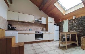 a kitchen with white appliances and a skylight at Beautiful Home In Frahan-Sur-Semois in Ban de Laviot