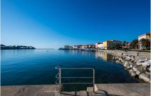 a view of a body of water with a metal railing at Apartman Porec Center Sea in Poreč