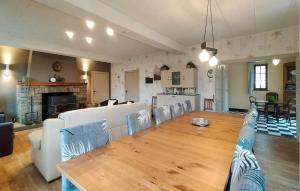 a living room with a large table and chairs at 5 Bedroom Stunning Home In Rochehaut in Rochehaut