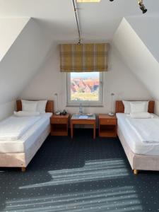 Postel nebo postele na pokoji v ubytování Haus Köbesine