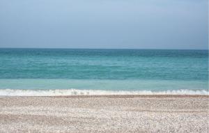 a rocky beach with the ocean in the background at 2 Bedroom Awesome Apartment In Moncofa in Moncófar