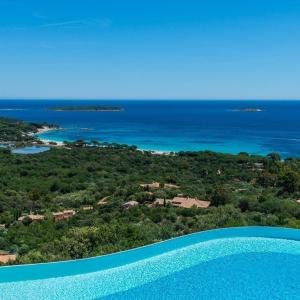 an aerial view of the ocean and a resort at Résidence Belvedere de Palombaggia in Porto-Vecchio