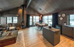 a living room with a kitchen and a dining room at 3 Bedroom Beautiful Apartment In Gol in Gol
