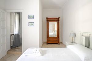 Postel nebo postele na pokoji v ubytování Villa Vittoria B&B