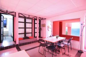a room with a table and chairs and a bed at Apartment with beautiful views - Muralla0218 in Calpe