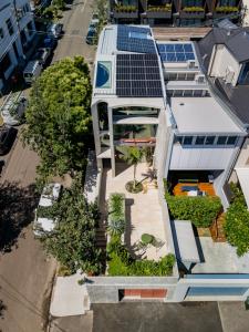 an aerial view of a house with solar panels on it at Camperdown - Luxury Architectural Escape in Sydney