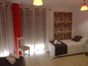 Postel nebo postele na pokoji v ubytování Hostel Conil