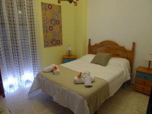 Postel nebo postele na pokoji v ubytování Hostel Conil