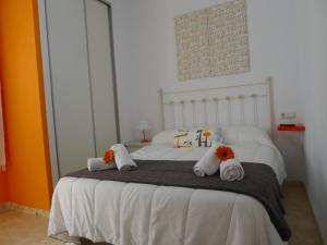 Postel nebo postele na pokoji v ubytování Hostel Conil