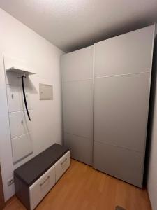 a room with a closet with a bench in it at Ferienwohnung Nummer 17 in Bad Rodach