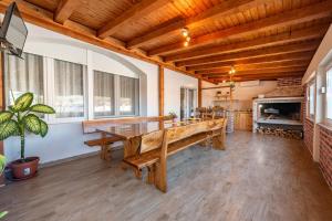 a large dining room with a large wooden table at Villa Luma ZadarVillas in Gorica