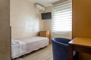 Postel nebo postele na pokoji v ubytování Hotel San Giorgio