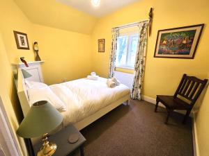 Ένα ή περισσότερα κρεβάτια σε δωμάτιο στο North Lodge South