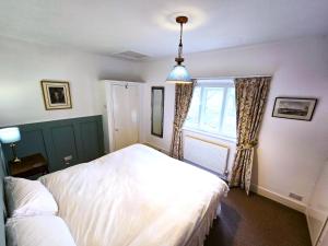 Ένα ή περισσότερα κρεβάτια σε δωμάτιο στο North Lodge South
