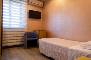Postel nebo postele na pokoji v ubytování Hotel San Giorgio