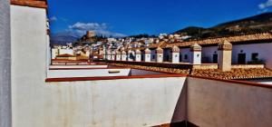 a view of a city from the roof of a building at Velez Nazari 2 in Vélez de Benaudalla