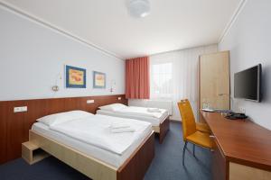 Postel nebo postele na pokoji v ubytování Hotel Nikolas