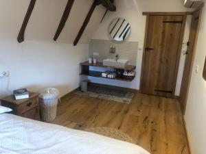 Postel nebo postele na pokoji v ubytování Le Vieux Fournil