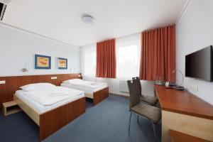 Postel nebo postele na pokoji v ubytování Hotel Nikolas